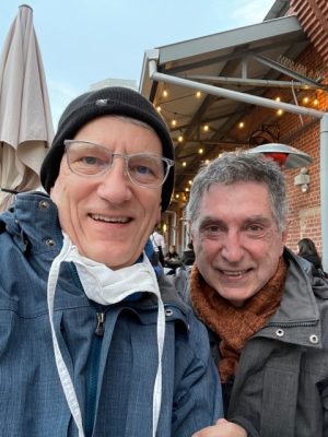 Dr. John Wiesman and his husband, Ted Broussard, have dinner outside in 45 degree weather.