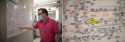 Walter Friday, a research technician in the Trujillo Lab, points out choline on a chart of metabolic pathways that hangs in the lab. “I bet you didn’t know that your body was doing all of this all the time,” he says. (Photos by Alyssa LaFaro)
