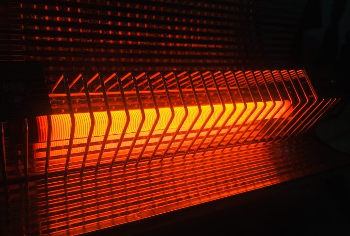 A space heater glows orange.