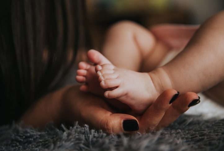 Child feet with hands