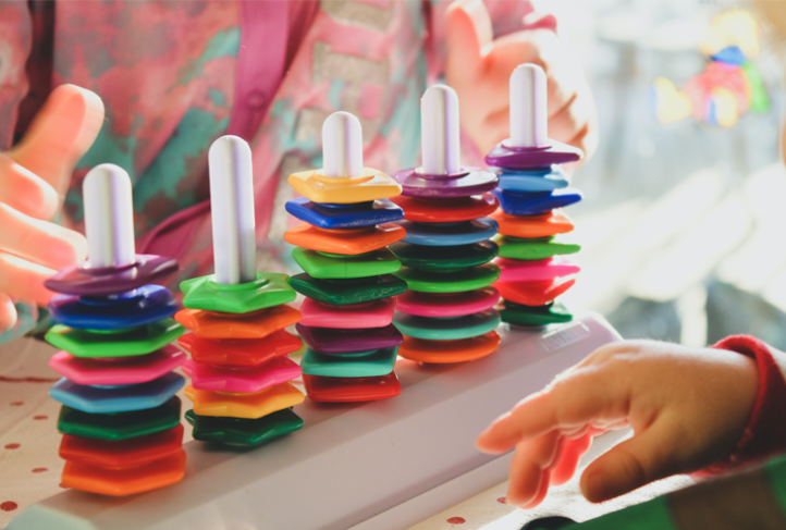 Children play with colorful toys.