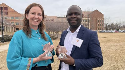 Drs. Emily Bedell and Musa Manga pose with their Global Engineering Awards.