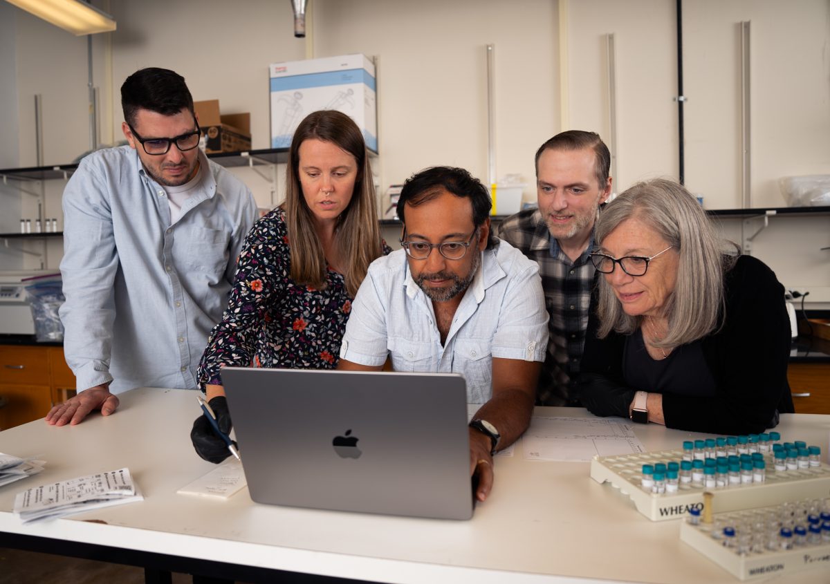 Dr. Nabarun Dasgupta (center) works with his team in the lab. (Photo credit: Pearson Ridley)