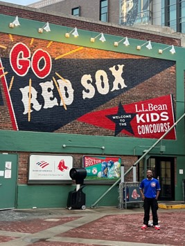 Eric Brown in front of Red Sox sign