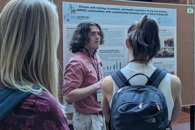 UNC student Evan Goodman presents his research about private well water contamination at the Partnerships for Environmental Public Health
