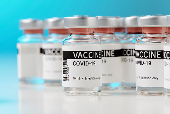 A group of COVID-19 vaccine vials are open and ready for use.